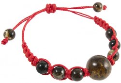 Amulet bracelet with a red thread and greenish amber balls