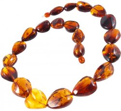 Beads made of amber stones in the shape of heart and drops