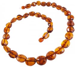 Beads made of amber stones in a cognac shade “Crumpled Cherry”