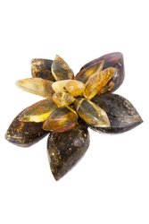 Designer brooch “Flower” made of different sizes of amber stones