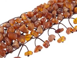 Multi-row braided bracelet made of polished dark amber stones