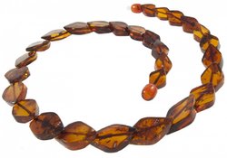 Beads made of figured amber stones