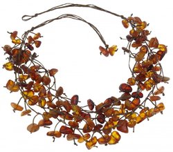 Amber beads made of stones on waxed thread