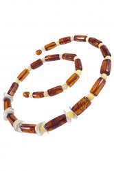 Amber beads with decorative inserts