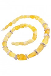 Amber beads with decorative inserts