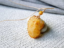 Amber pendant “Fish”