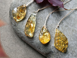 Polished amber stone pendant