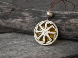 Amulet pendant made of deer antler and amber “Kolovrat” (Ladinets)