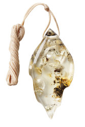 Pendant made of polished light amber stone