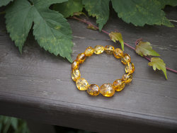 Amber bracelet made of light translucent polished stones