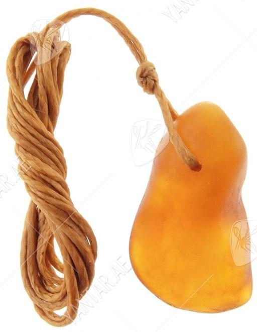 Medical pendant made of polished honey-colored amber