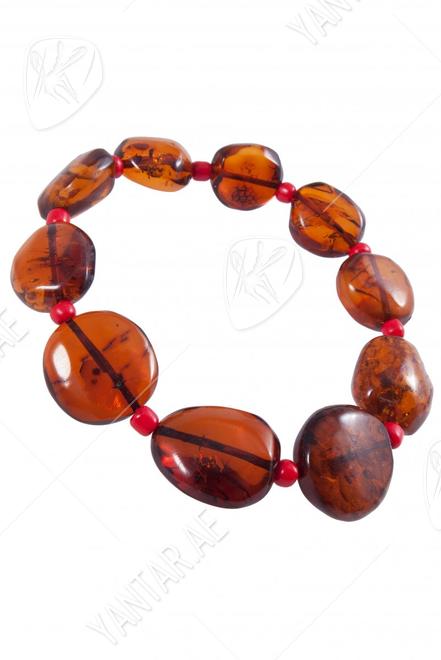 Bracelet made of amber stones-coins with beads