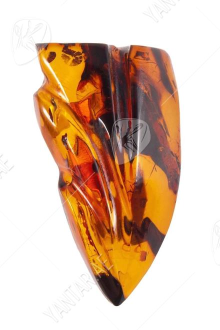 Amber brooch with relief carving