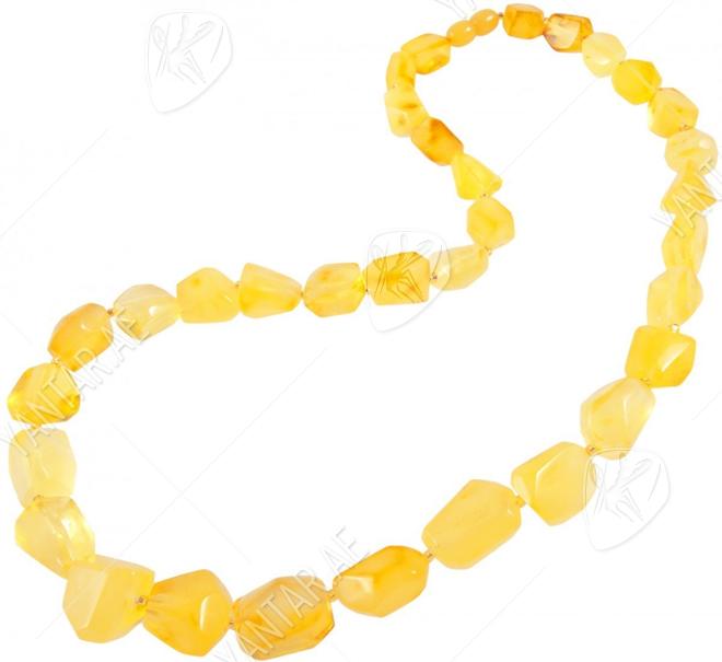 Beads made of light multifaceted polished amber stones