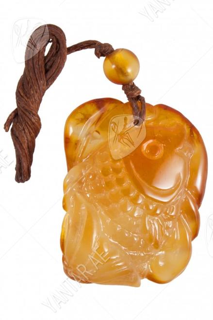 Amber pendant on a wax thread in the shape of a fish