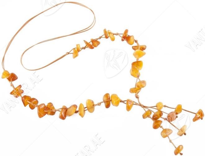 Braided beads made of polished amber stones of honey color