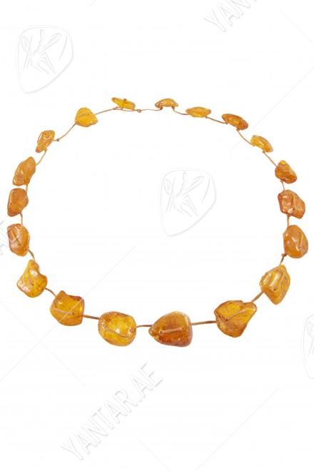 Beads-string made of honey-colored amber stones