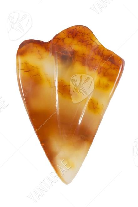 Relief brooch made of amber