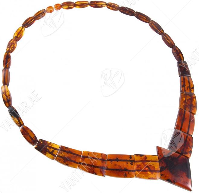 Beads with figured cognac-colored amber stones (with a diamond-shaped center)