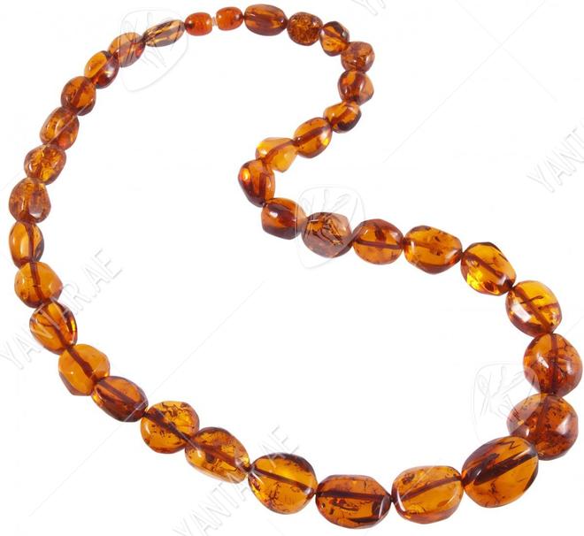 Beads made of amber stones in a cognac shade “Crumpled Cherry”