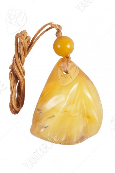 Pendant with relief stone and amber ball