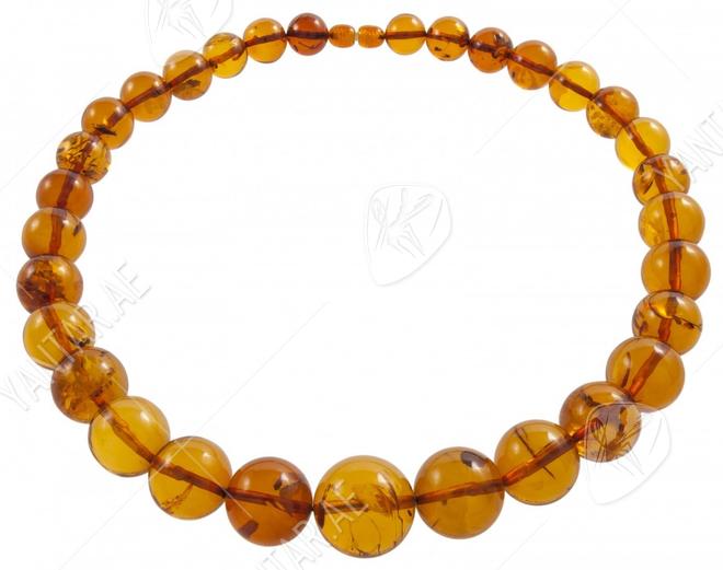 Beads-balls made of light amber