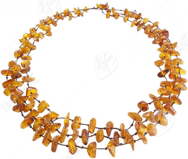 Three rows of beads made of polished amber stones