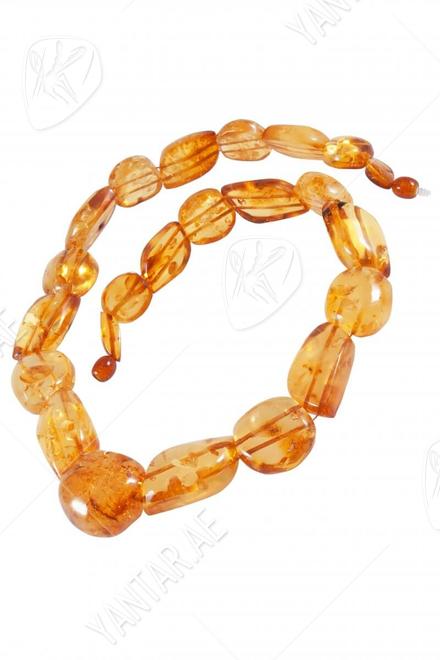 Beads made of figured amber stones