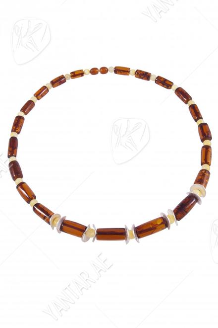 Amber beads with decorative inserts