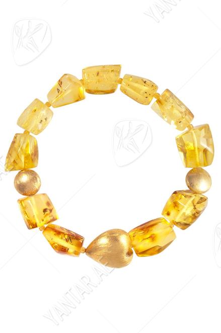 Amber bracelet with decorative inserts