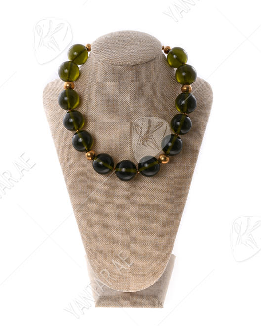 A necklace of greenish amber balls