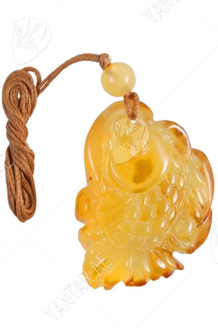 Amber pendant carved in the shape of a fish