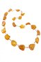 Beads-string made of honey-colored amber stones