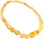 Amber beads made of light translucent polished stones