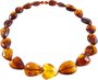 Beads made of amber stones in the shape of heart and drops