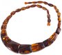 Beads made of figured amber stones of cognac color