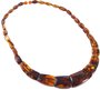 Beads made of figured amber stones of cognac color