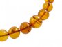 Beads-balls made of light amber