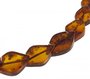 Beads made of figured amber stones