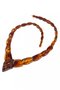 Beads made of cognac-colored amber stones (center with relief carving)