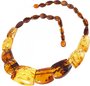 Amber beads made of figured stones