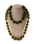 A necklace of greenish amber balls