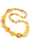 Beads made of light amber stones “Crumpled Cherry”