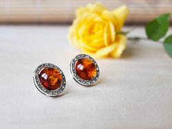 Silver button earrings with amber “Wheel of Fortune”