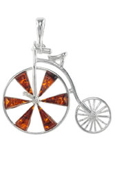 Silver pendant with amber “Penny farthing”