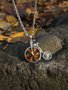 Silver pendant with amber “Penny farthing”