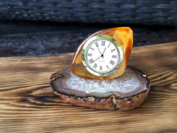 Amber clock on an agate stand