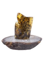 Amber souvenir with inclusion on a stand