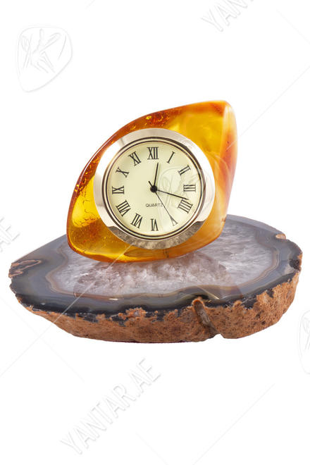 Amber clock on an agate stand