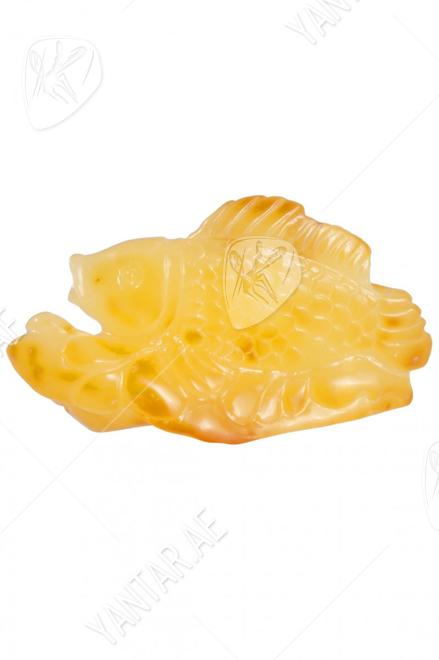 Amber souvenir with carving “Goldfish”